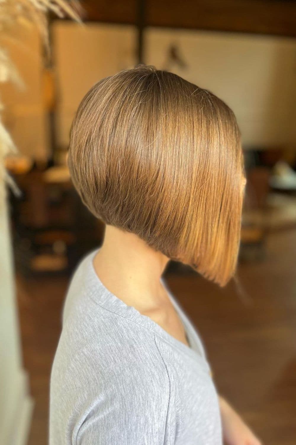 Side view of a woman with an angled bob cut.