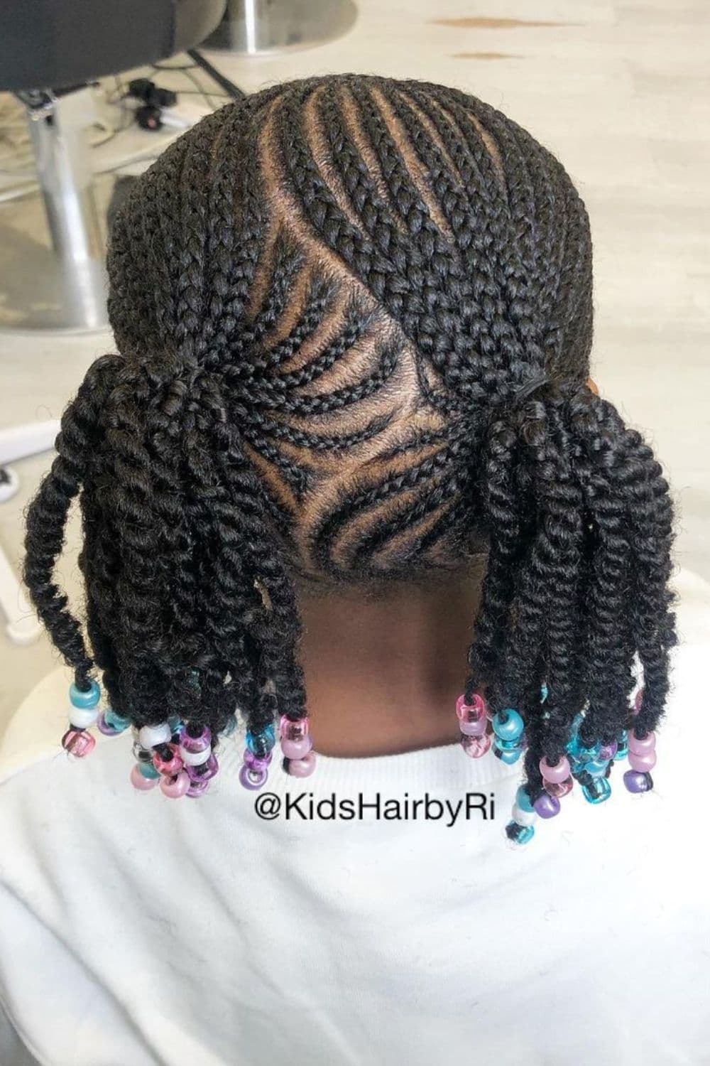 Back view of a child with beaded curvy cornrows.