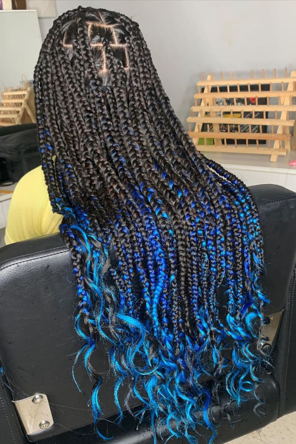 A person with black to blue ombre braids.