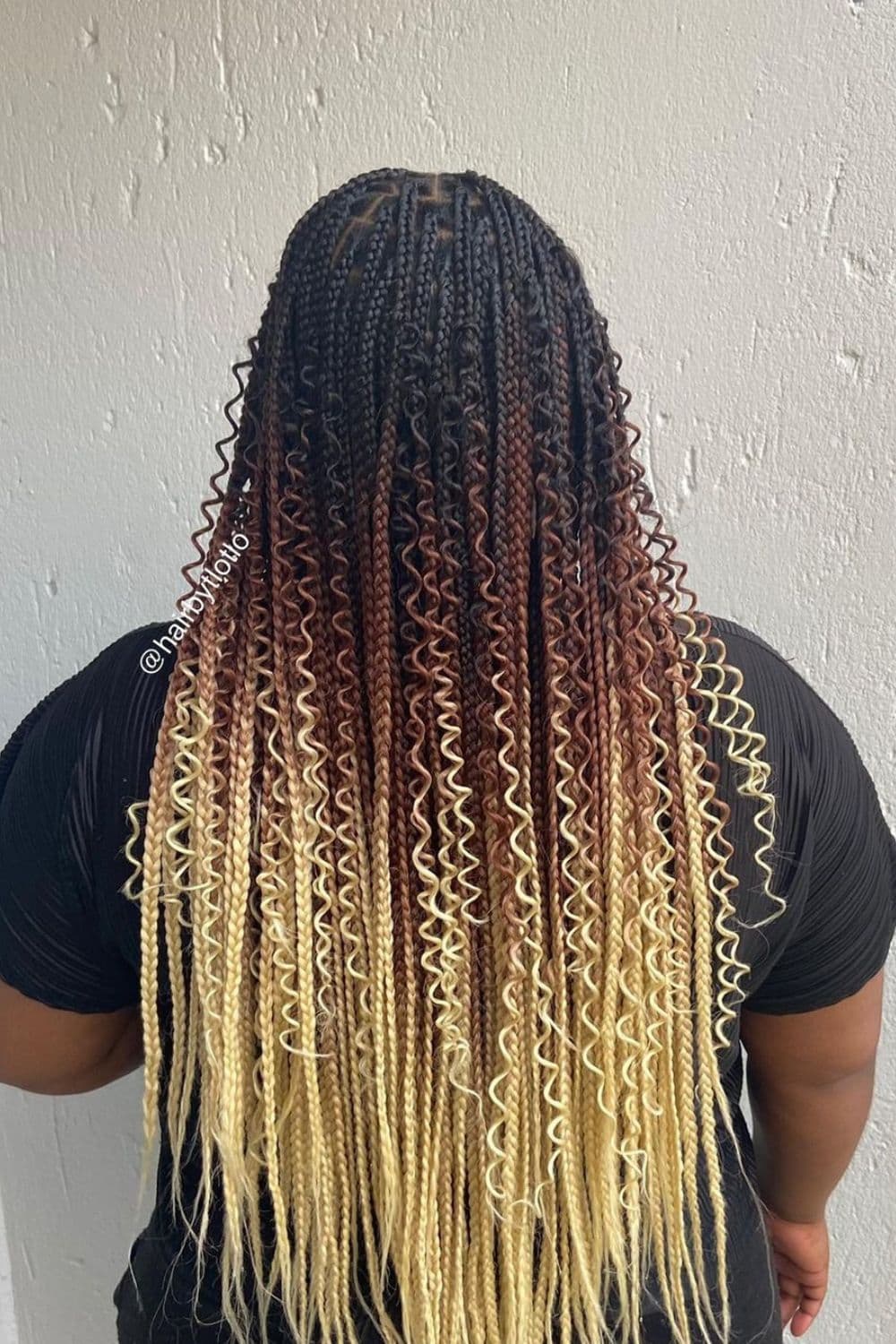 A woman with blonde ombre goddess braids.