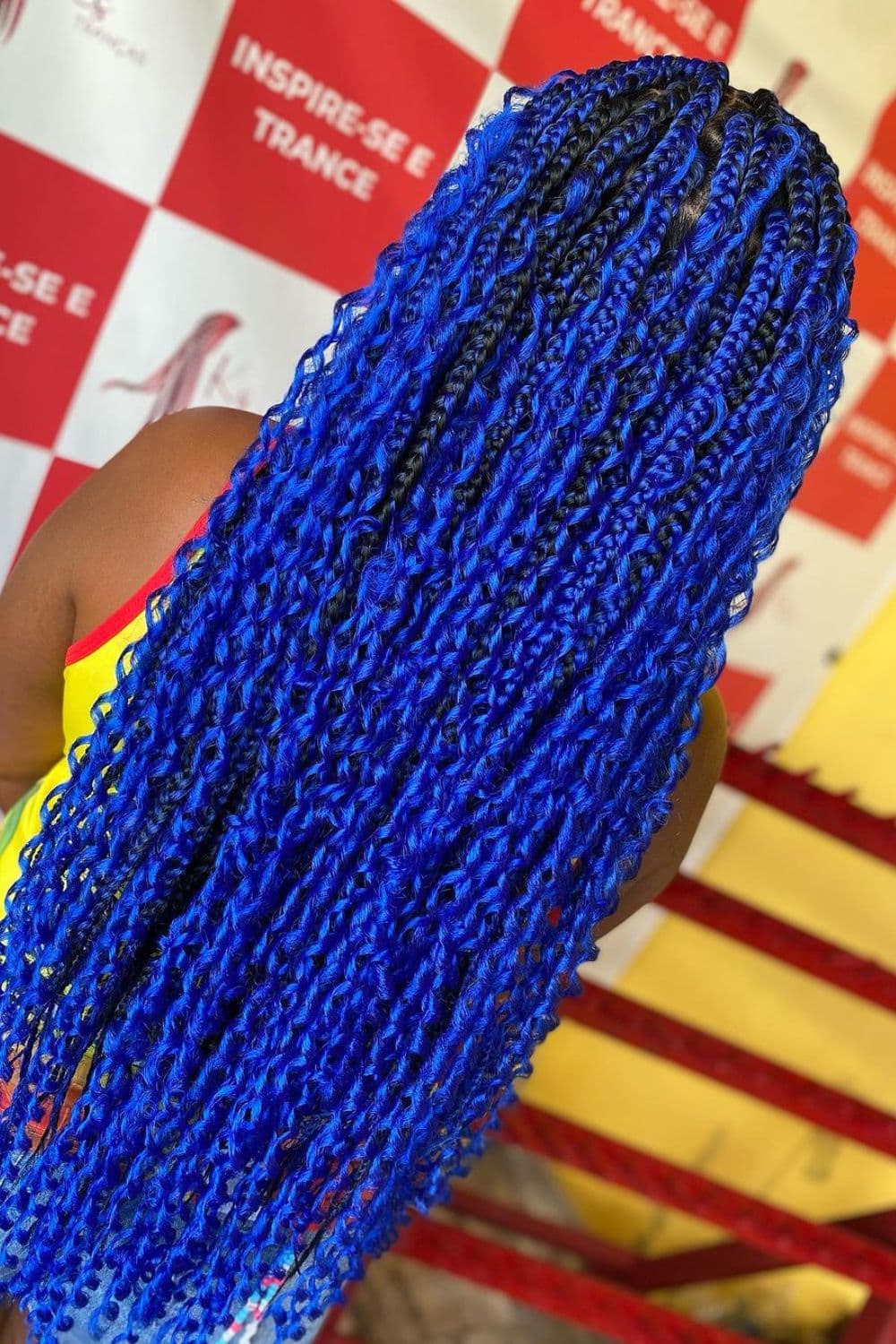A woman with blue goddess braids.