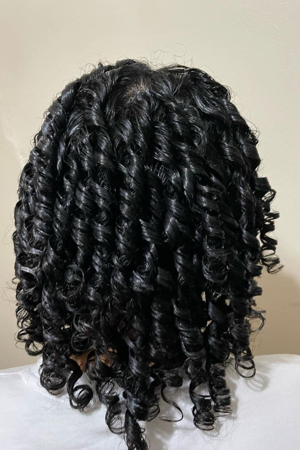 A person with a black chunky comb twist.