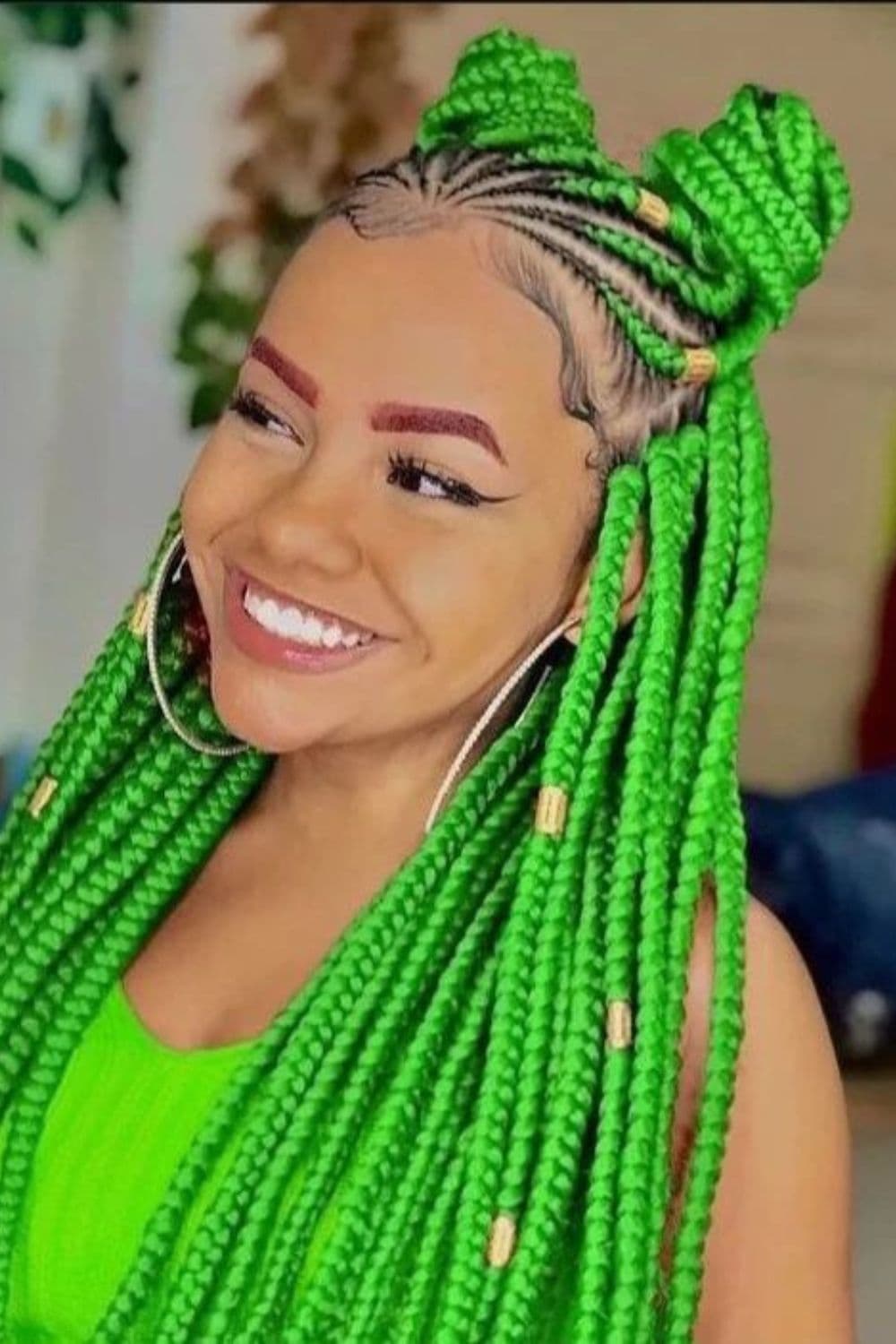 A woman with chunky green braids.