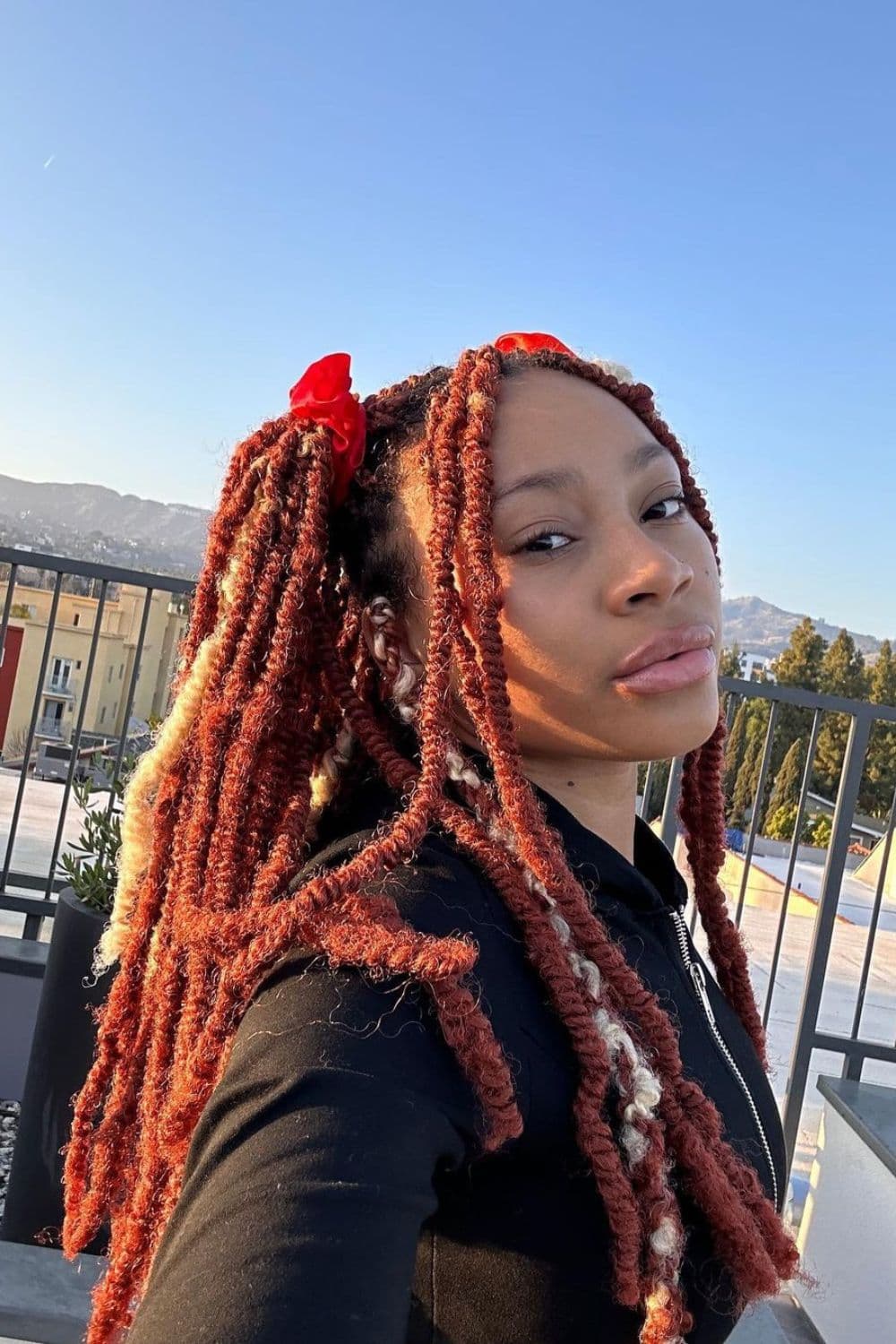 A woman with colored twists.
