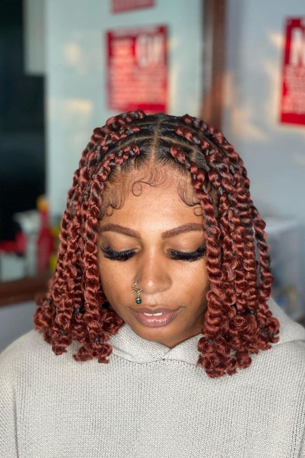 A woman with copper passion twists.