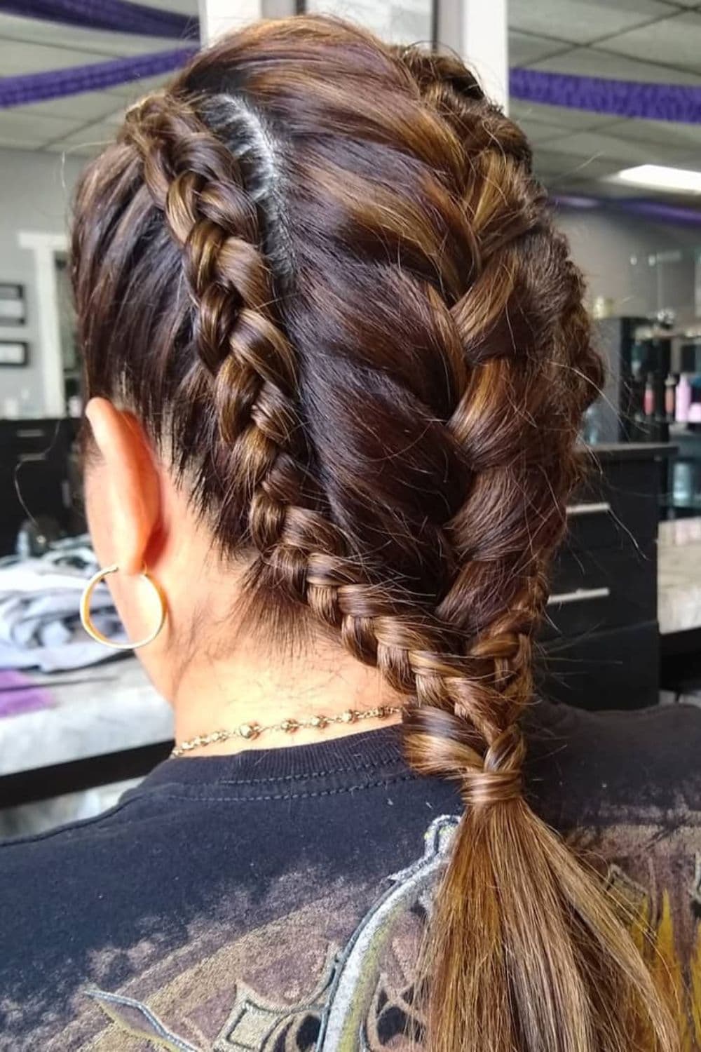 Close-up shot of a woman's French braid mohawk.