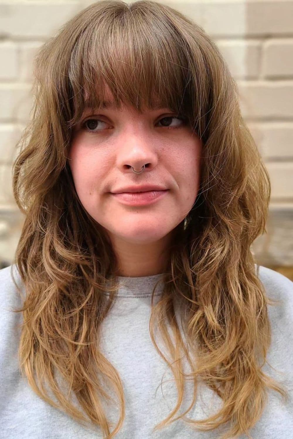 A woman with full bangs.