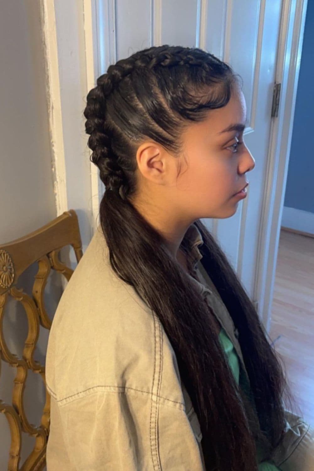 Side view of a woman with half French braids.