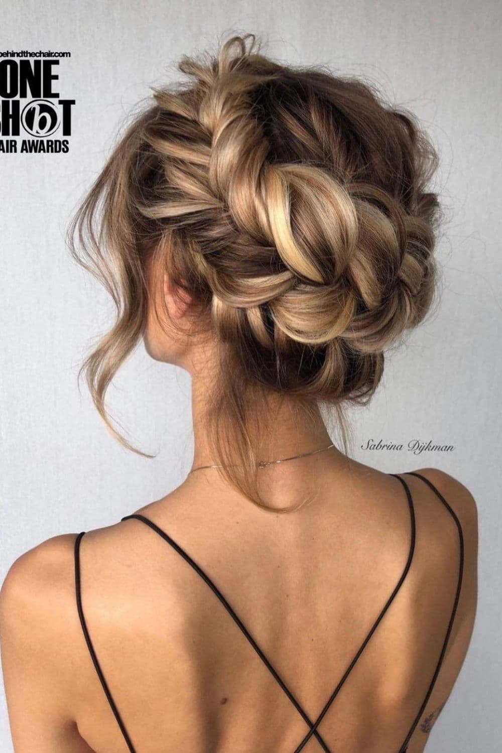 A woman with a blonde halo braid.