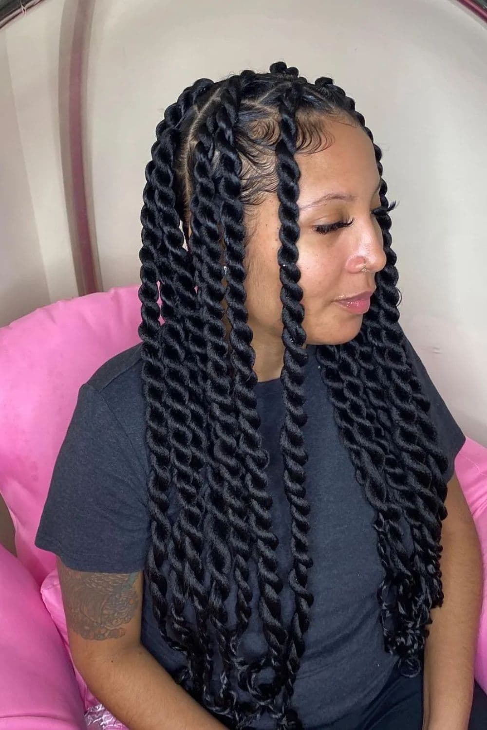Side view of a woman with jumbo twists.