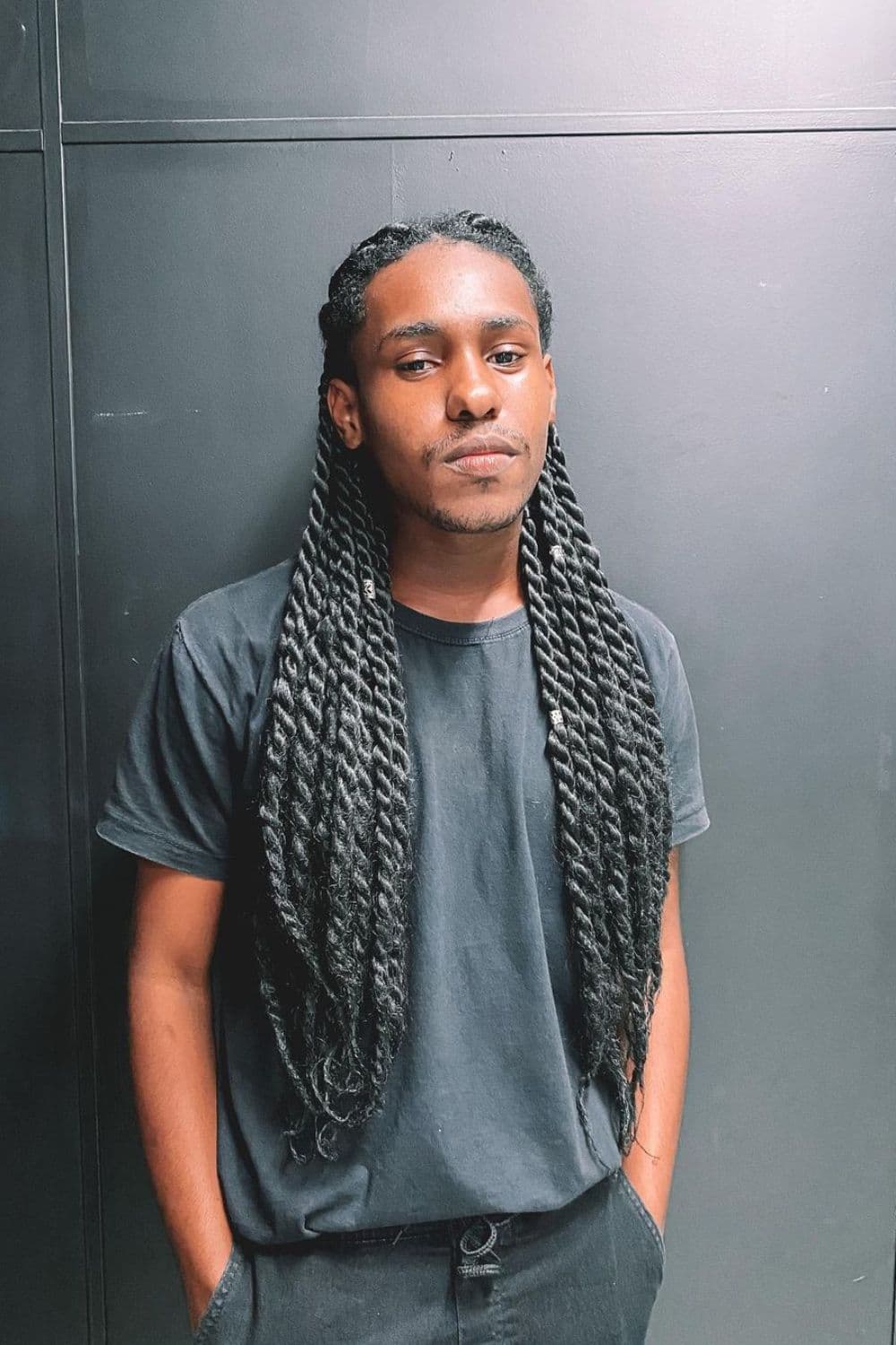 A man with long black twists.