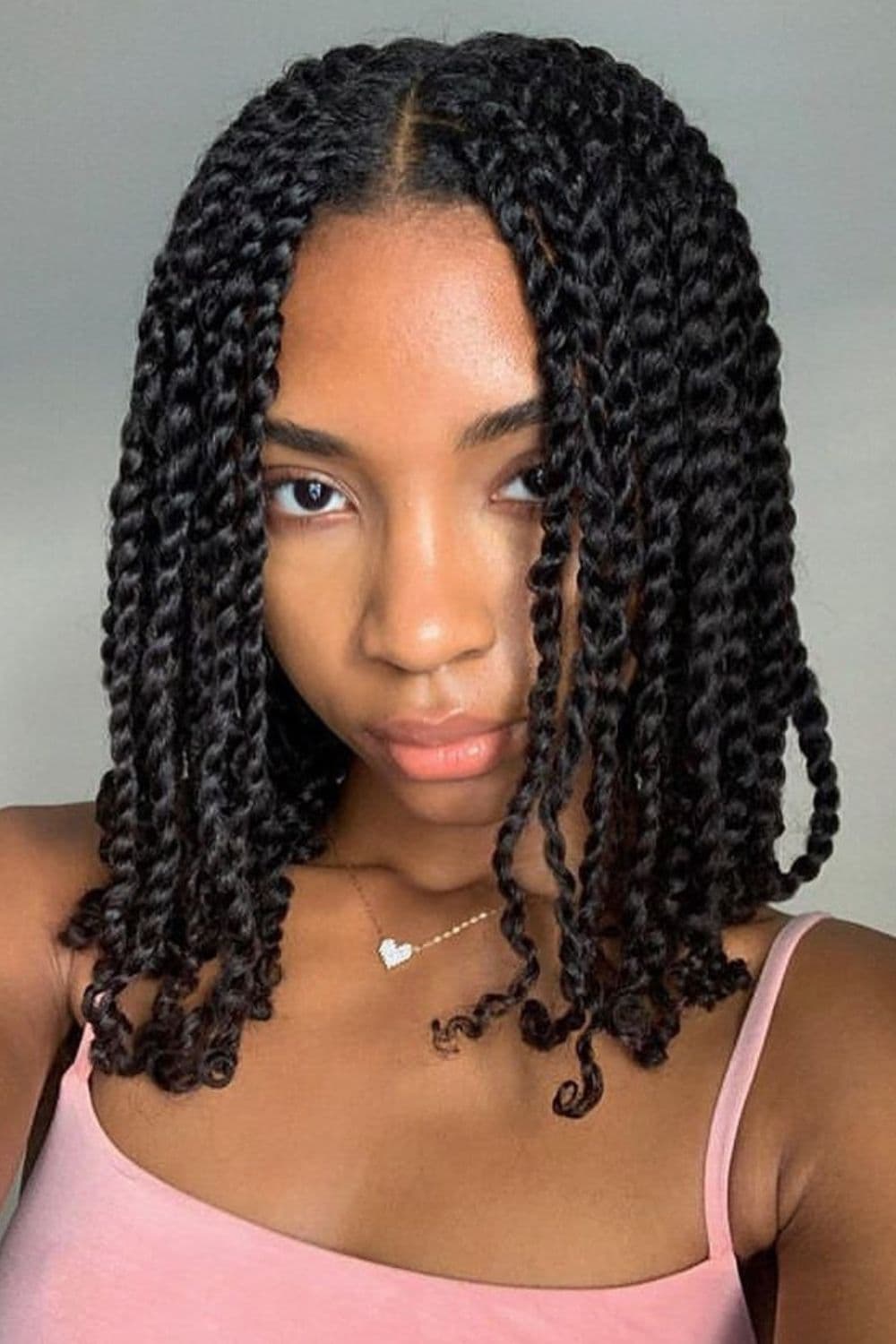 A woman with loose mini two-strand twists.
