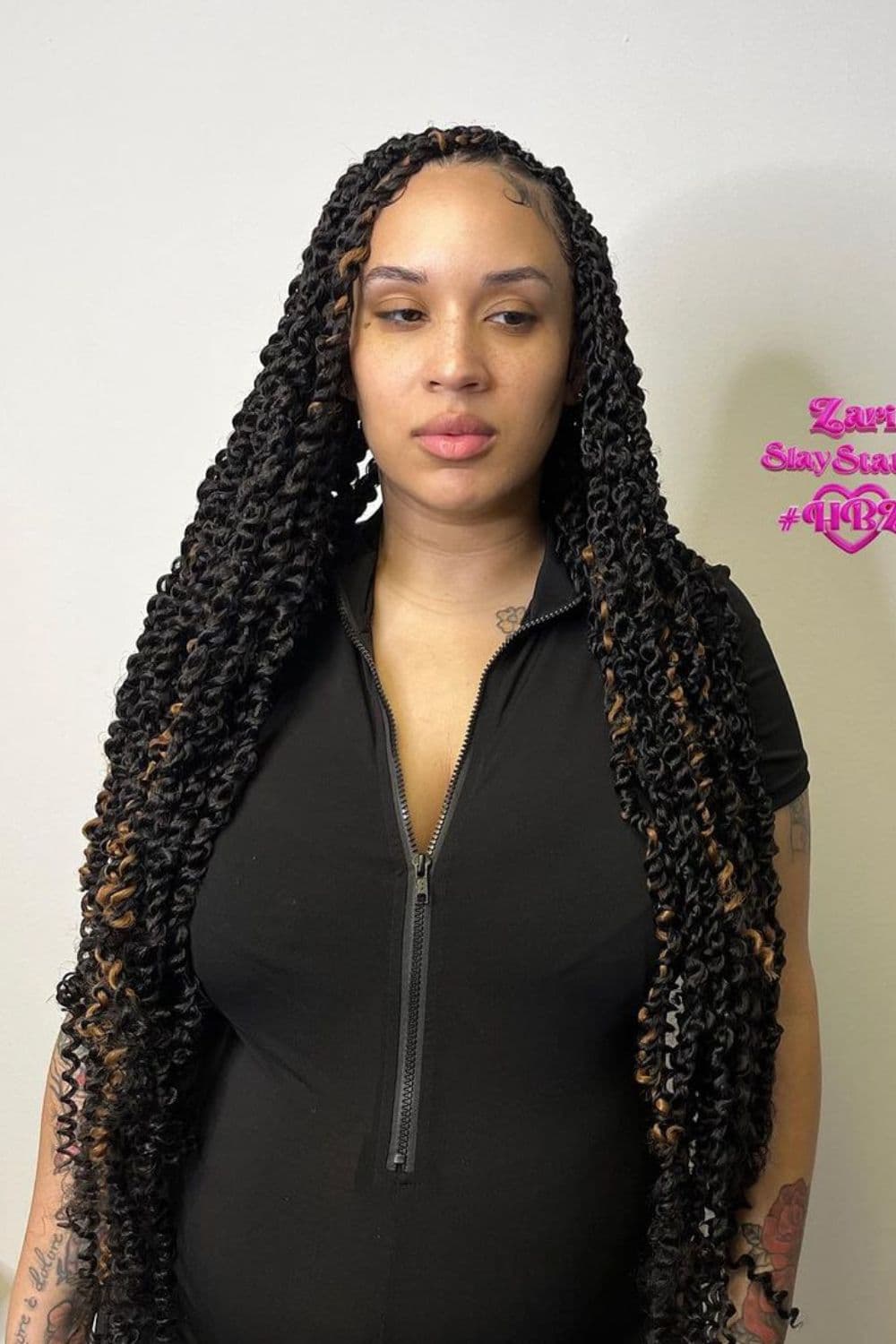 A woman with black and brown mini passion twists.