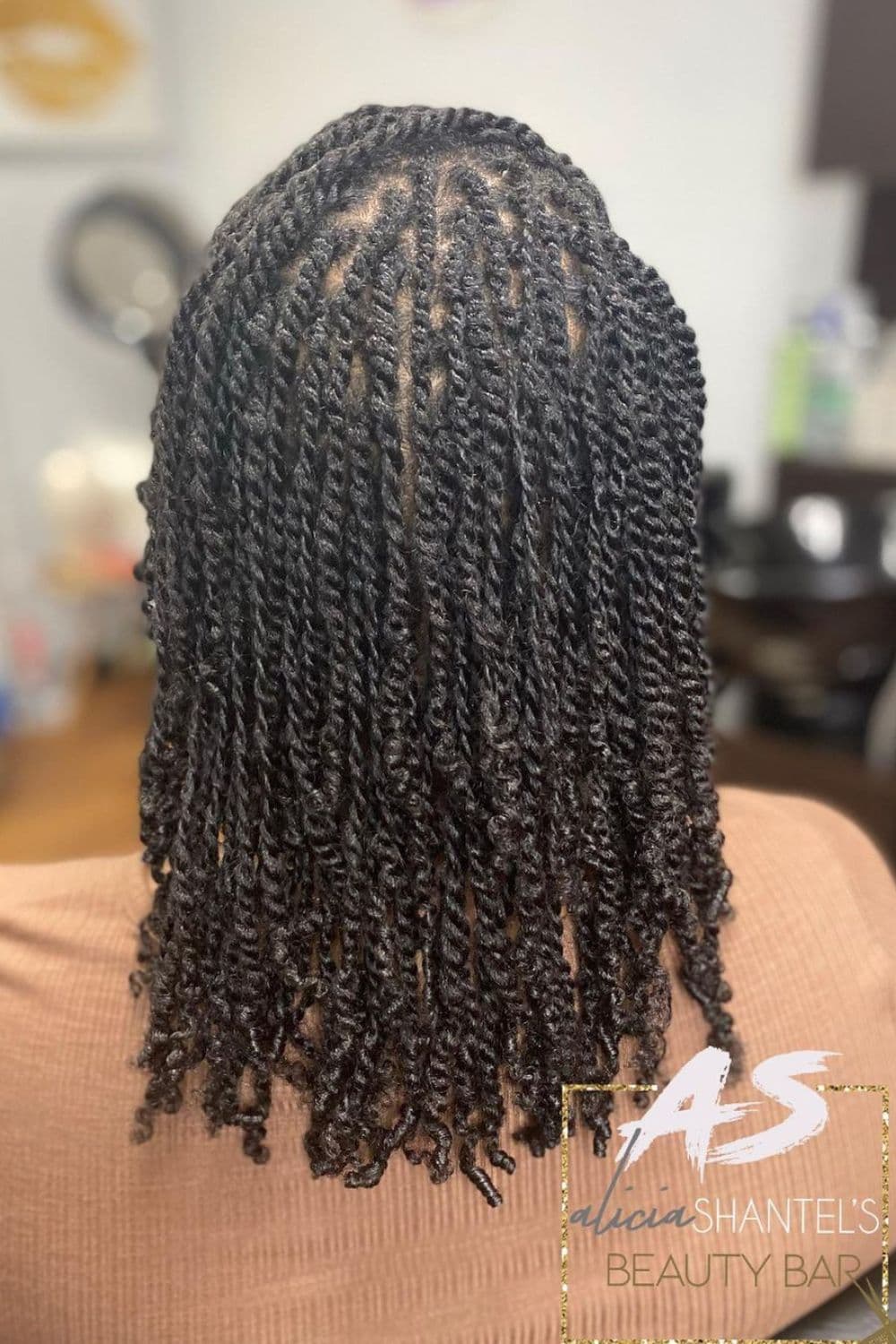 A woman with mini two-strand twists.