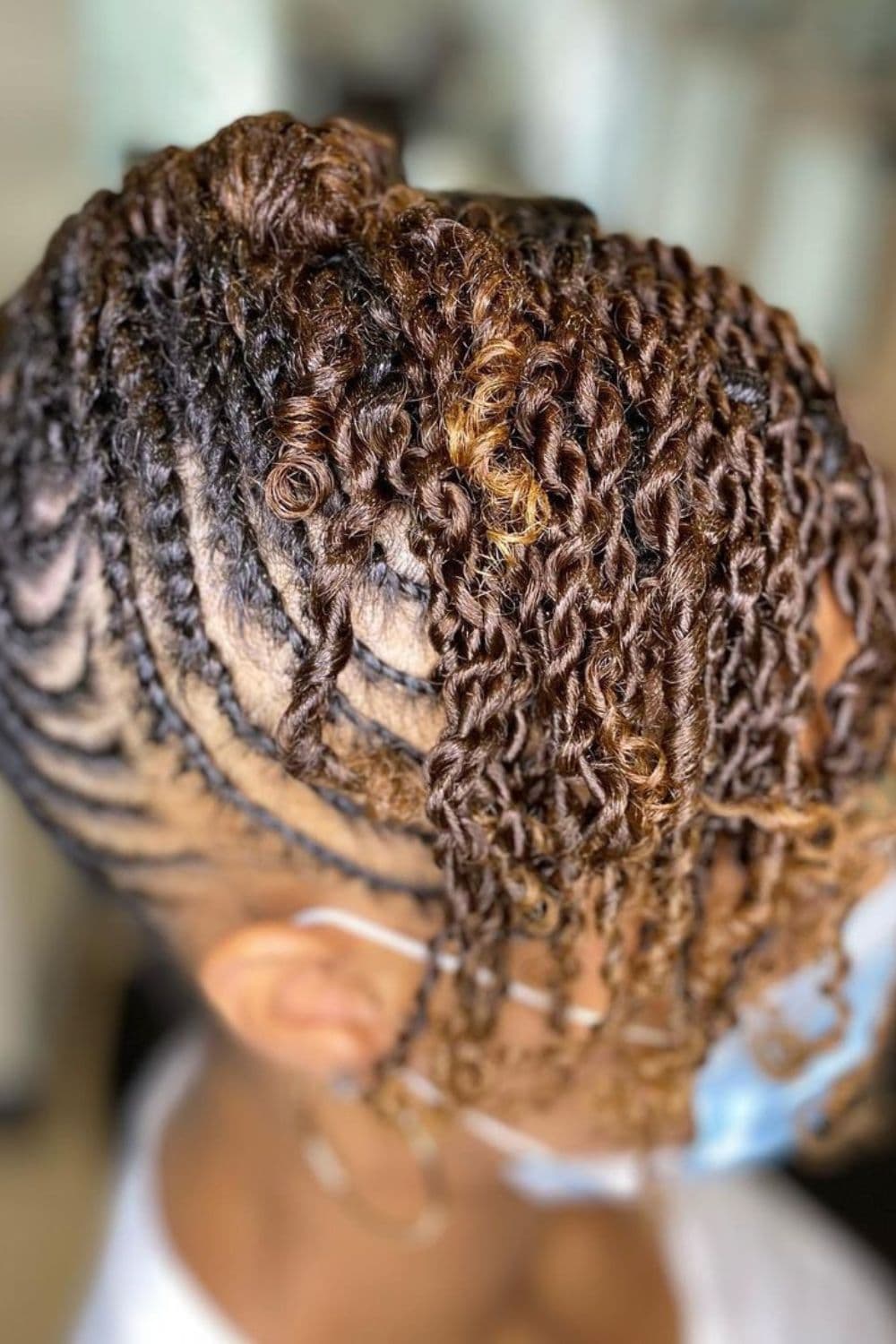 Close-up of a woman's hair with mini two-strand twists with flat twists.