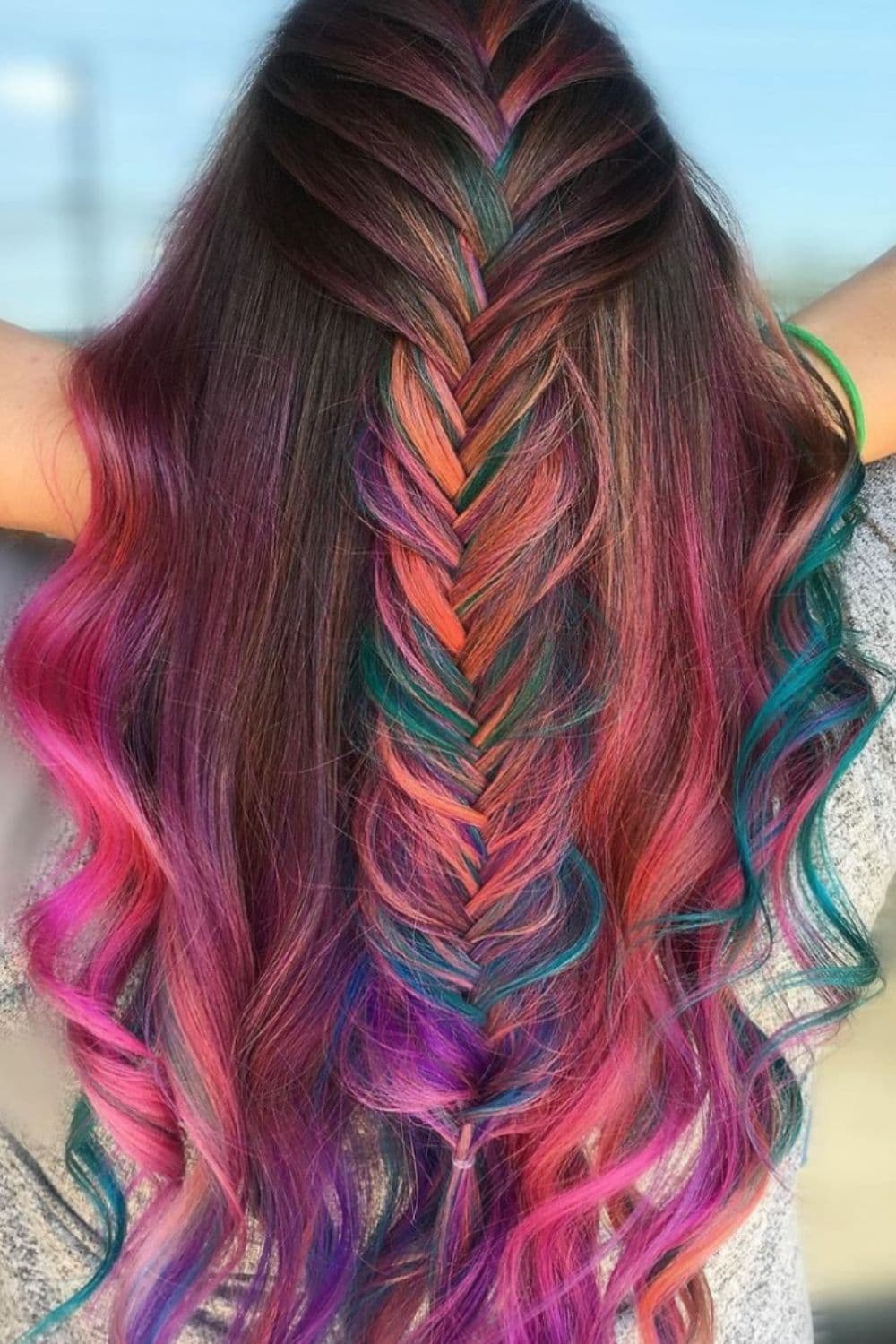 A woman with mixed color fishtail braids.