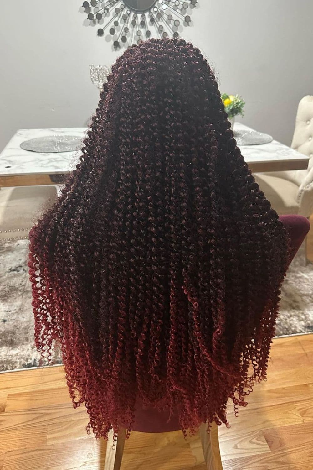 Back of a woman with red ombre crochet passion twist-out.