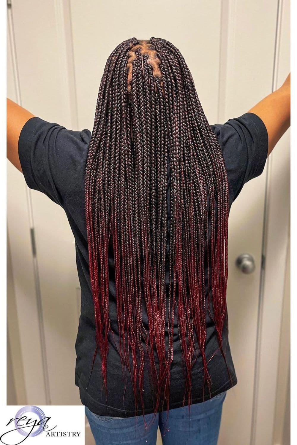 Back of a woman with ombre medium box braids.