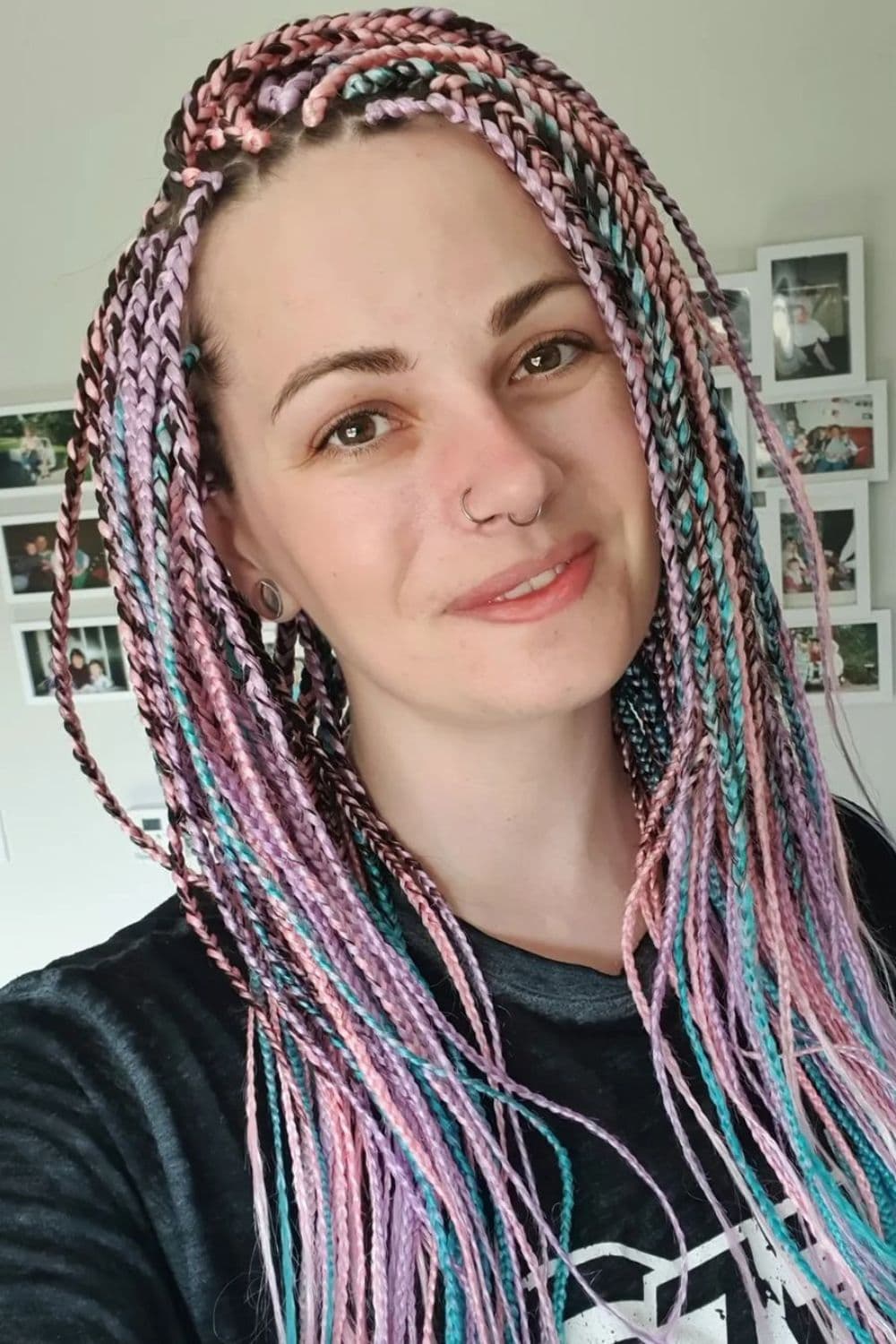 A woman with pastel box braids.