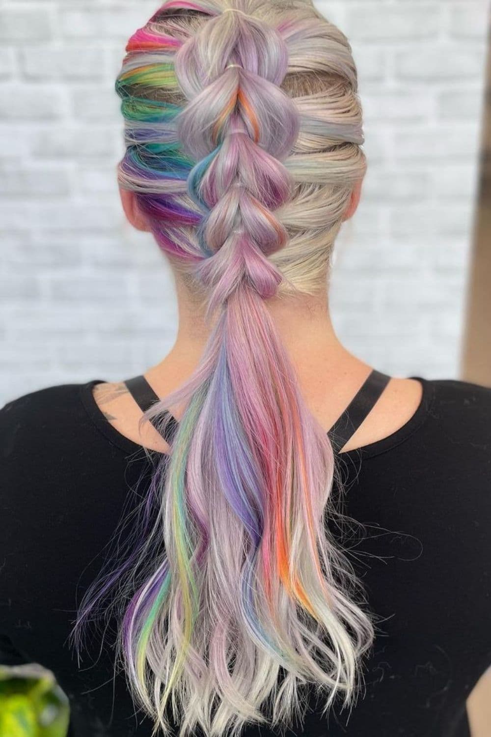 A woman with mixed colors pull-through braids.