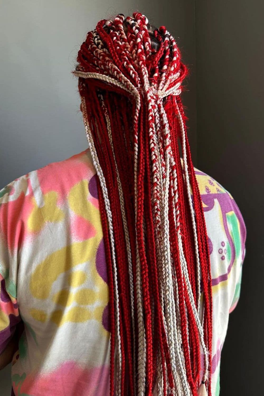 A man with red and white two-toned braids.