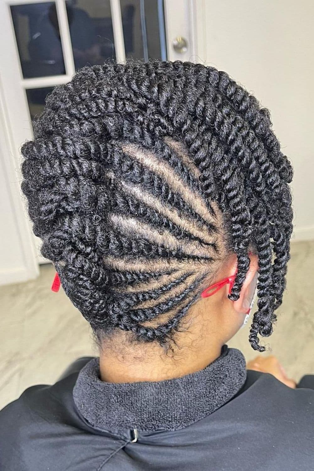 A woman with a two-strand twist updo.