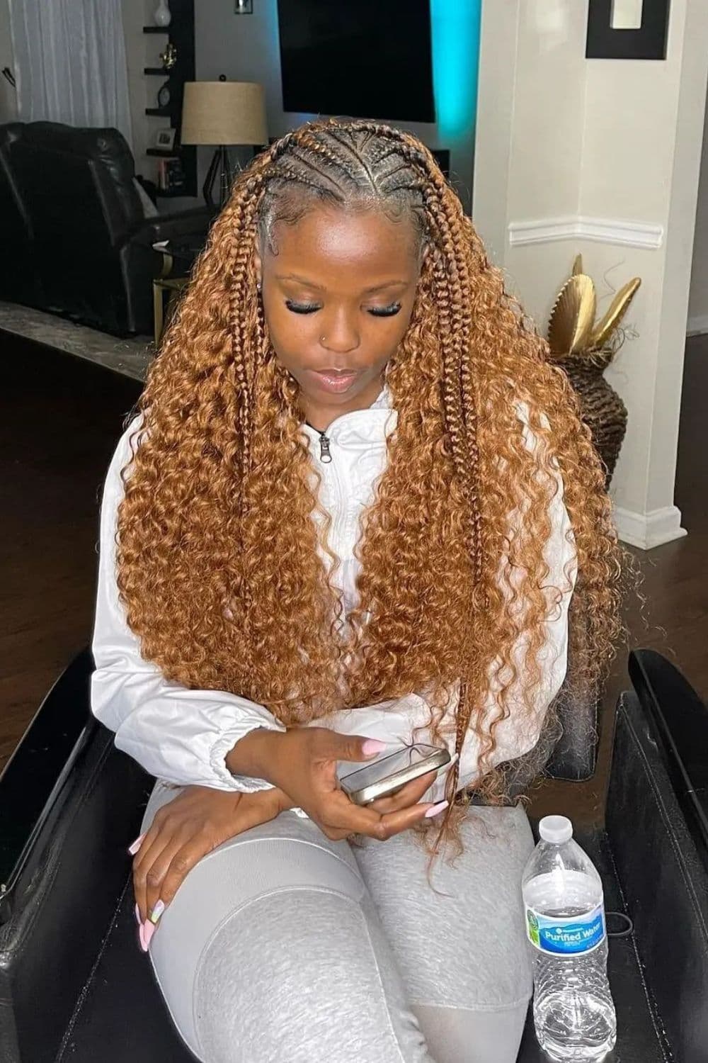A woman with brown crochet braids.
