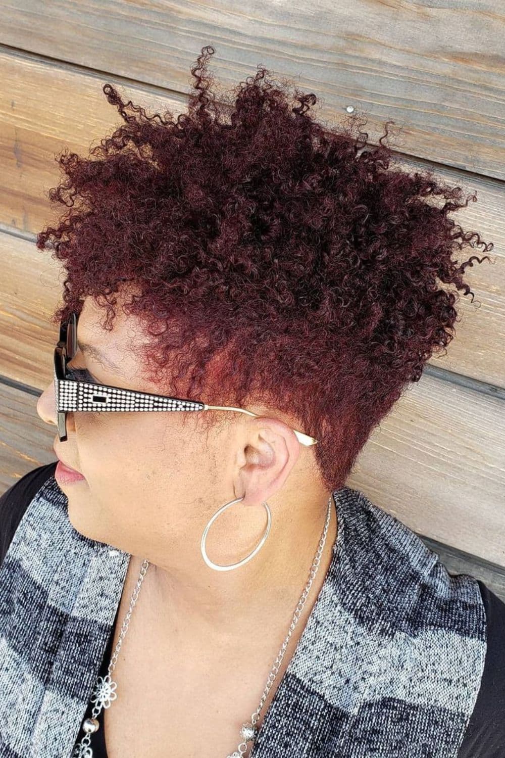 A woman with a burgundy taper cut.