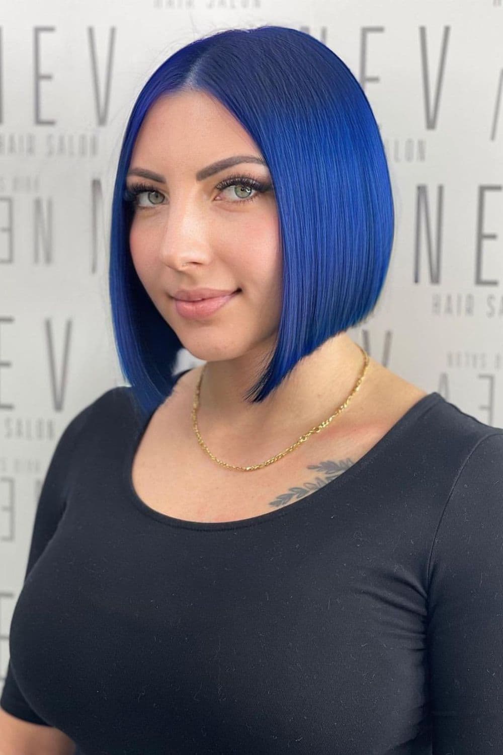 A woman with a blue center-parted A-line bob cut.