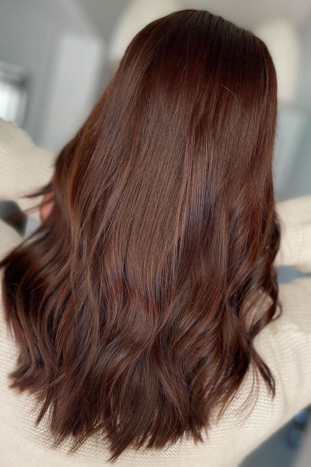 A woman with long chocolate brown hair.