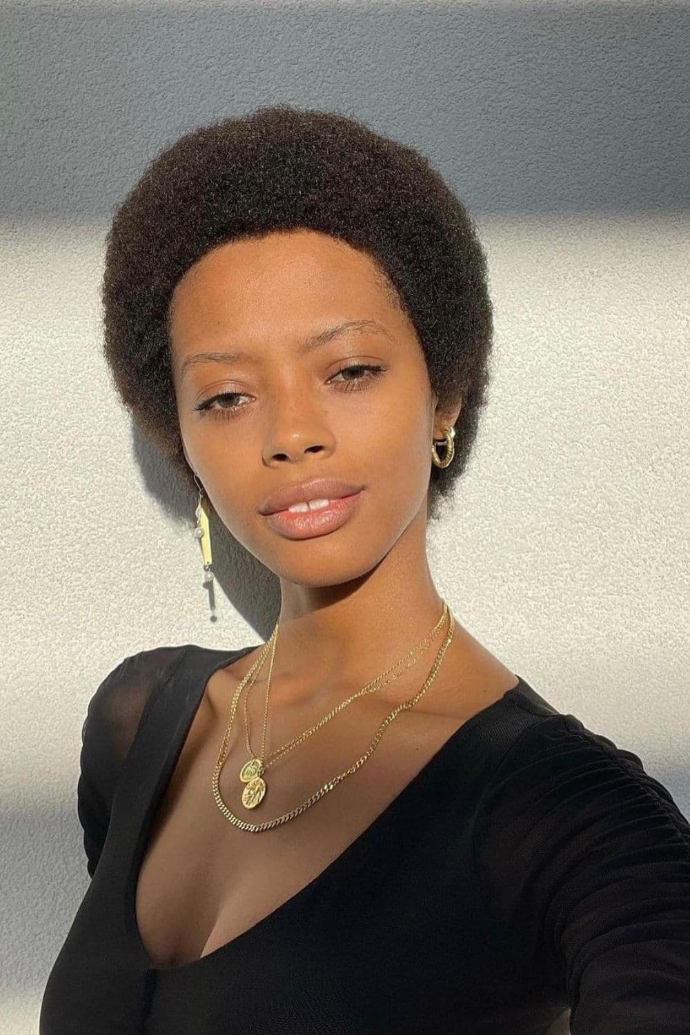 A woman with a classic Afro cut.