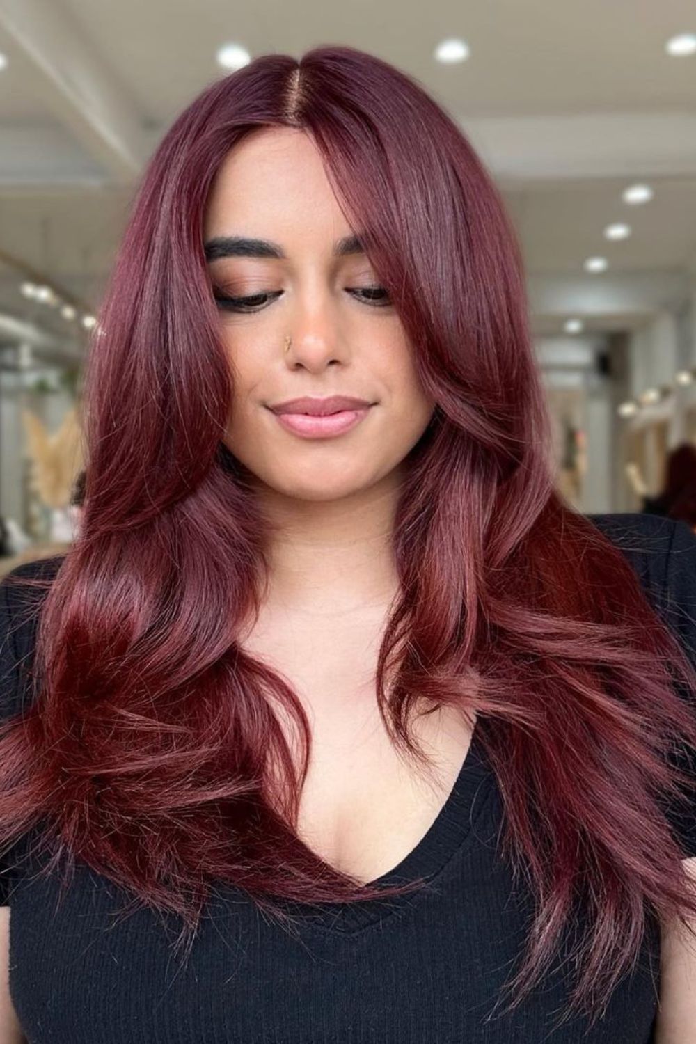 A woman with long copper red hair.