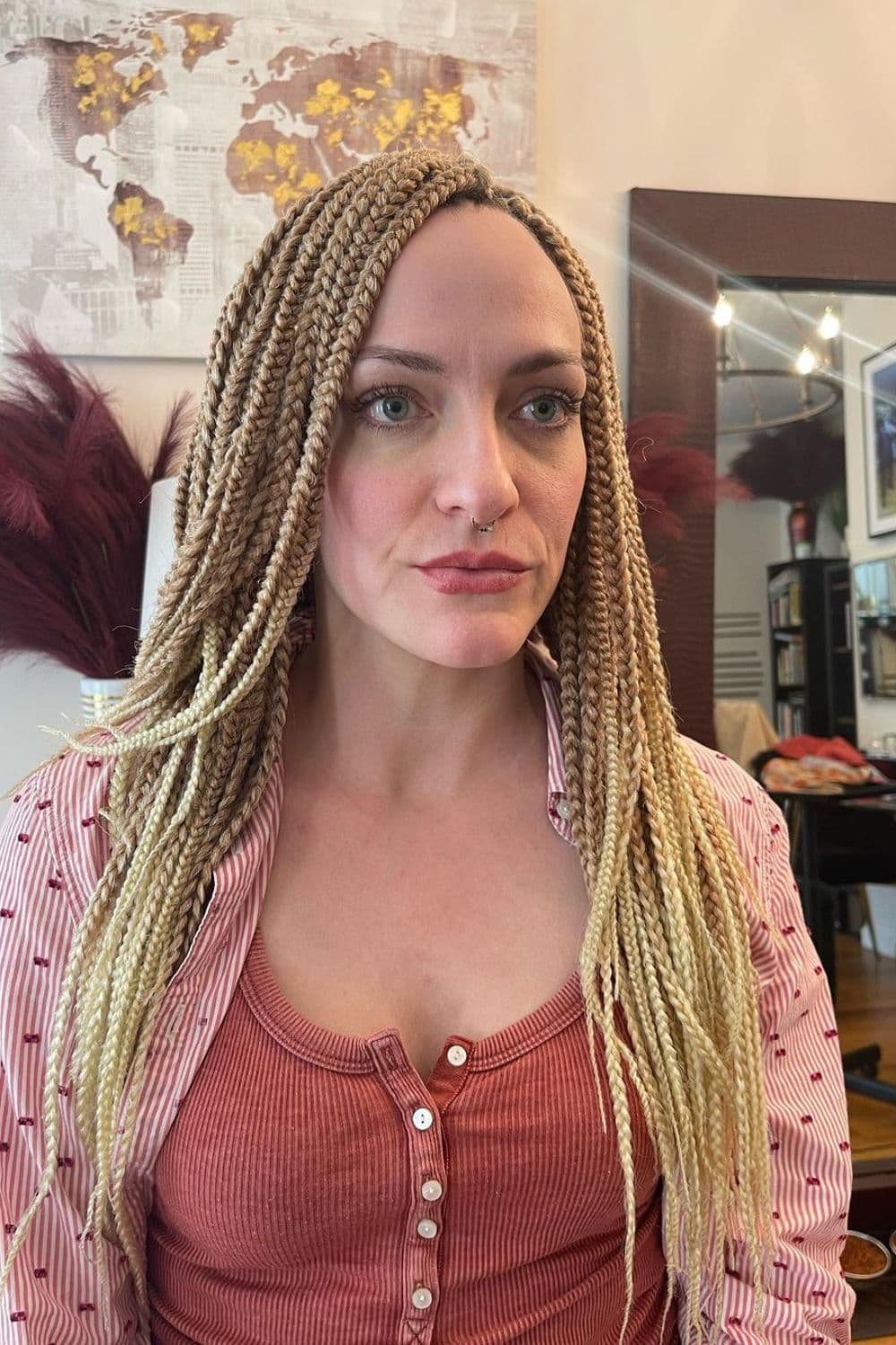 A woman with blonde crochet box braids.