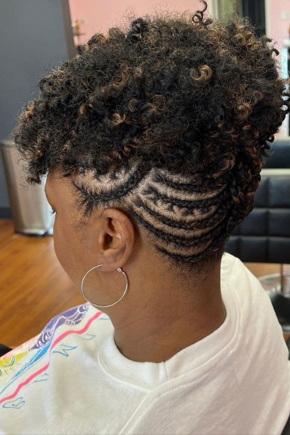 A woman with a crochet braid updo.