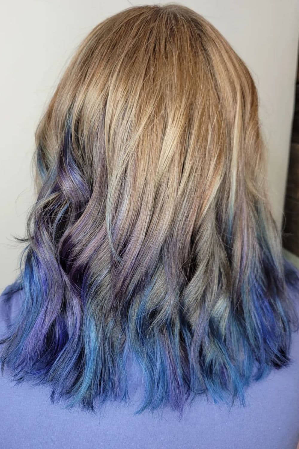 A woman with dip-dyed dirty blonde hair.