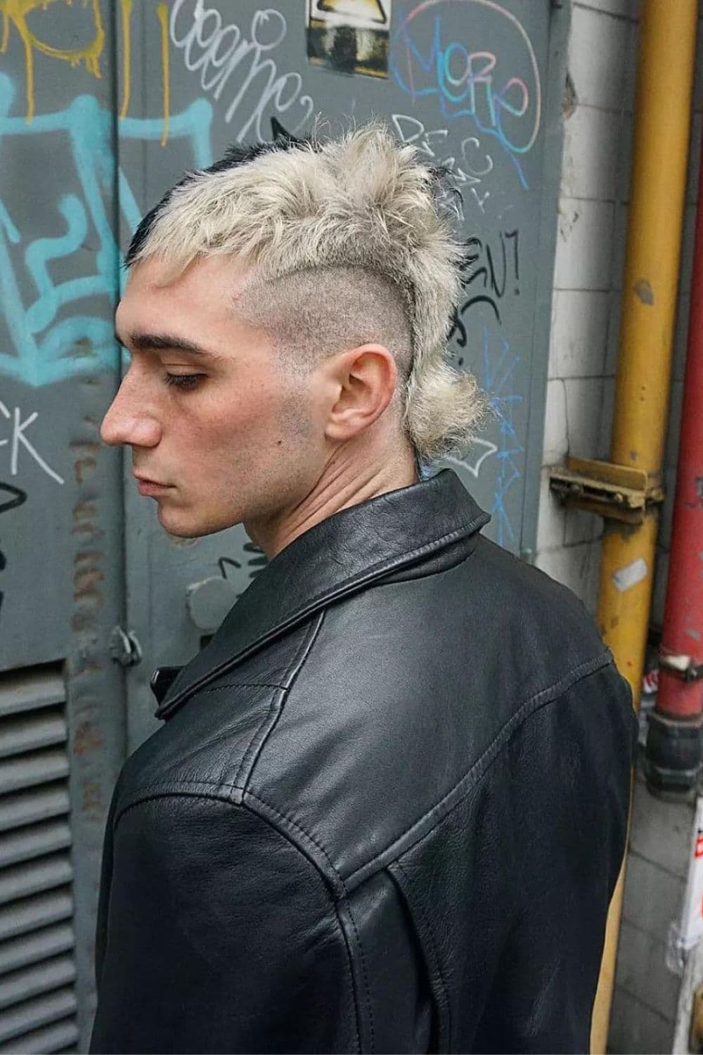 A man with a blonde faux hawk.