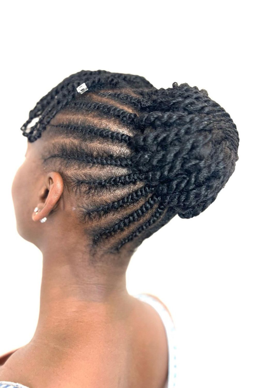 A woman with a flat twist updo.