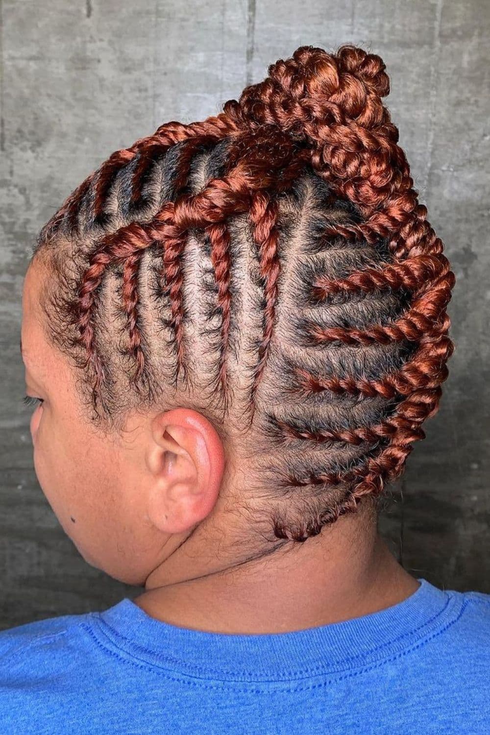 A woman with a brown flat twist updo.