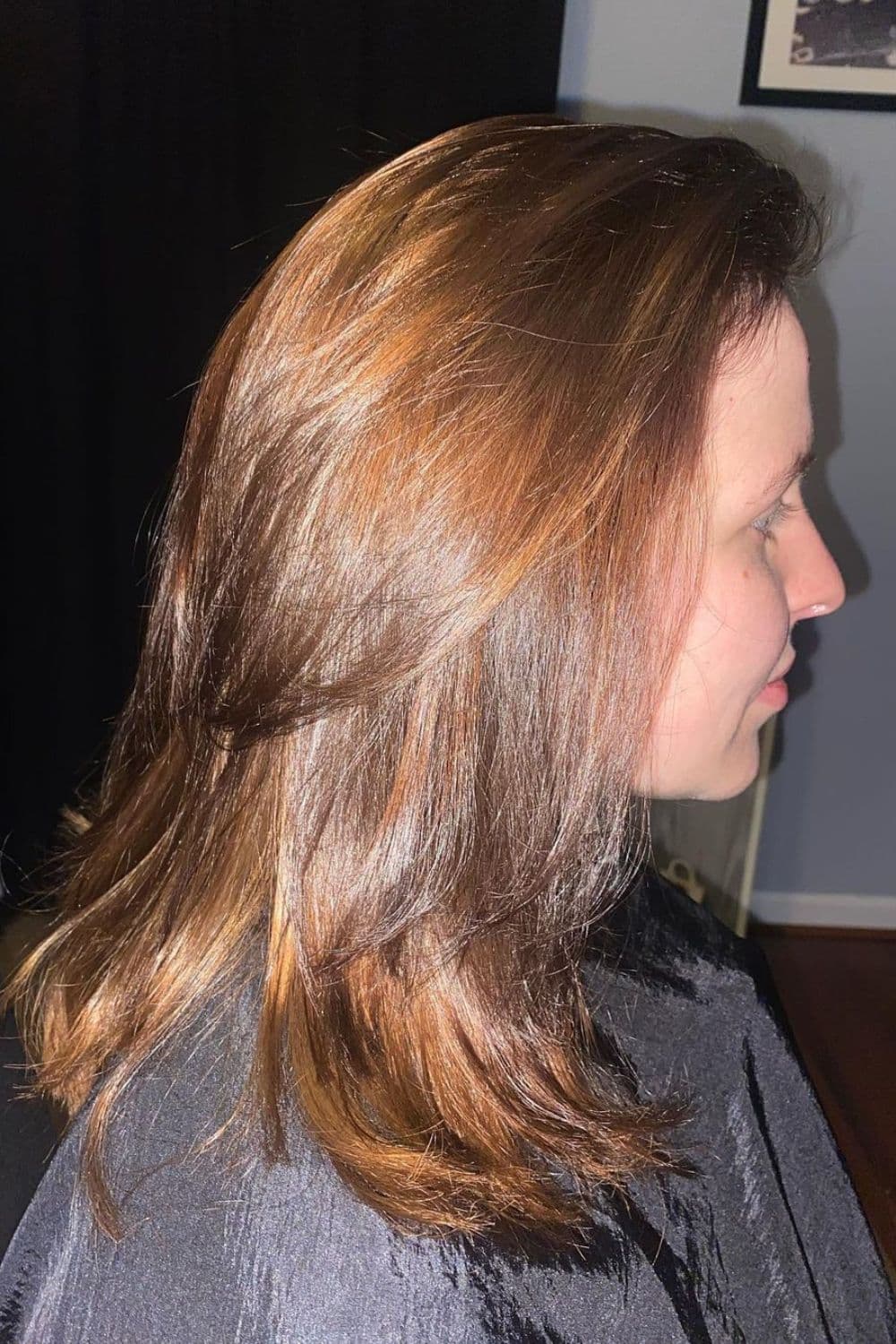 A woman with medium length golden dirty blonde hair.