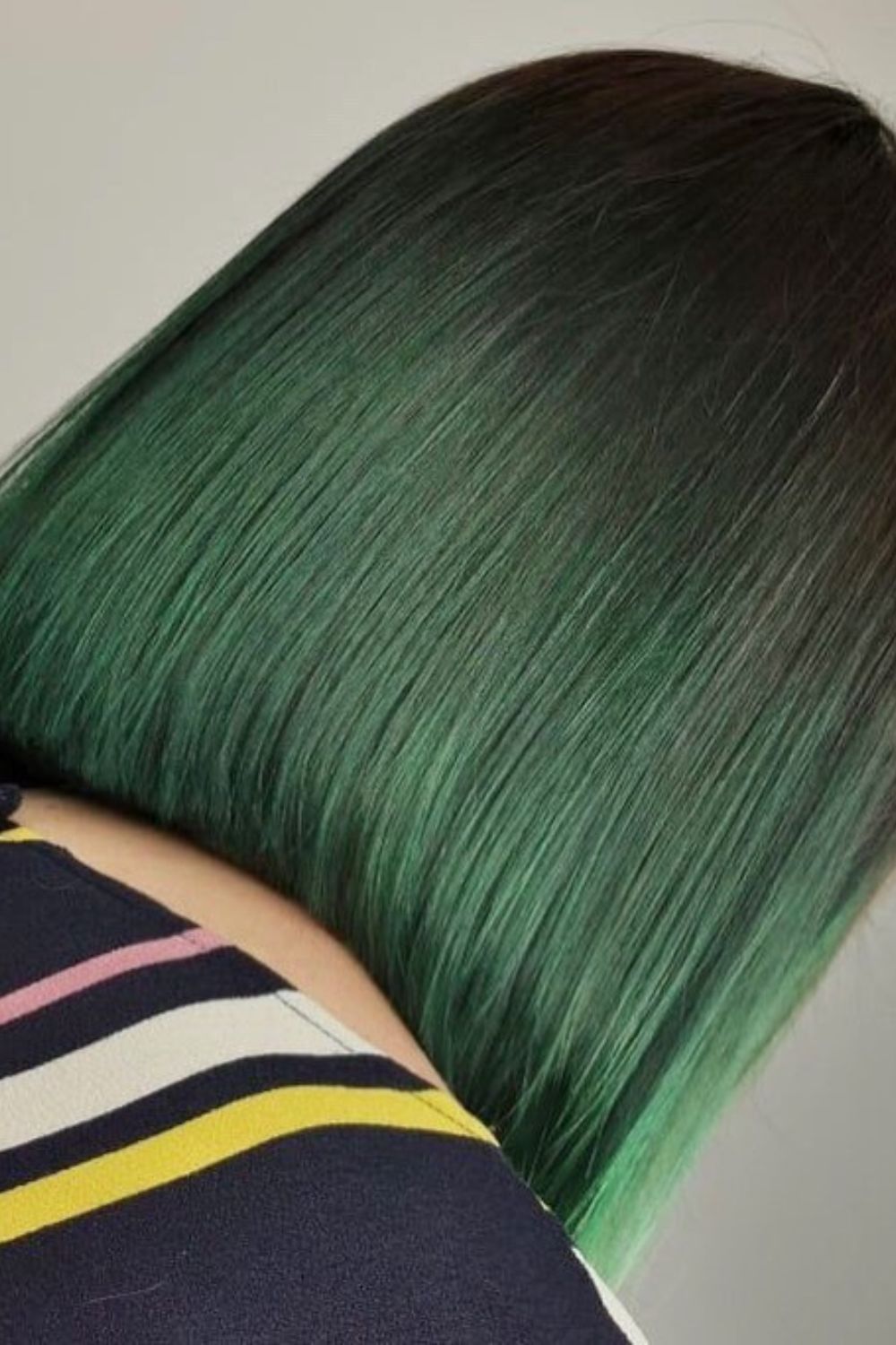 Close-up image of a green ombre lob hair.