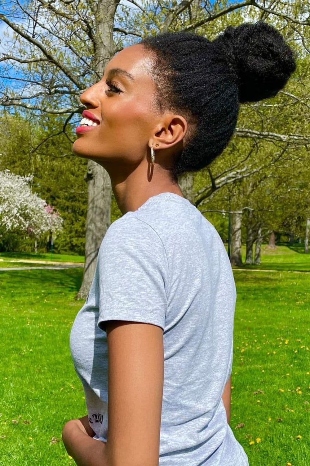 A woman with a 4C high bun.