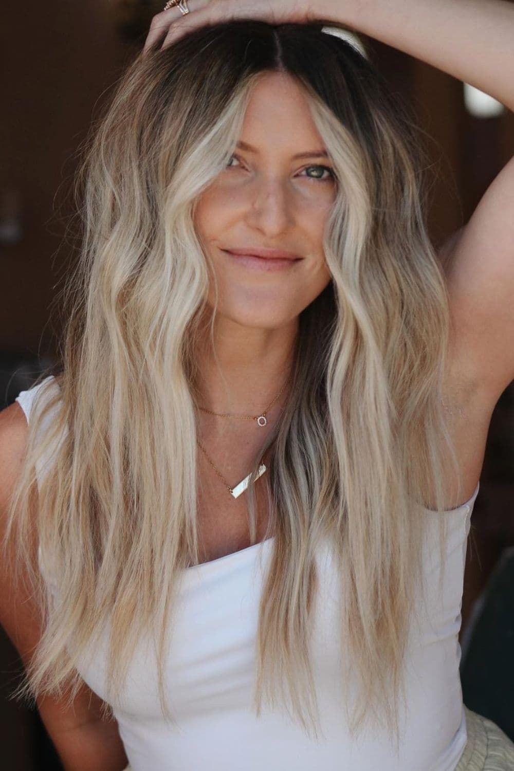 A woman with long high contrast balayage.