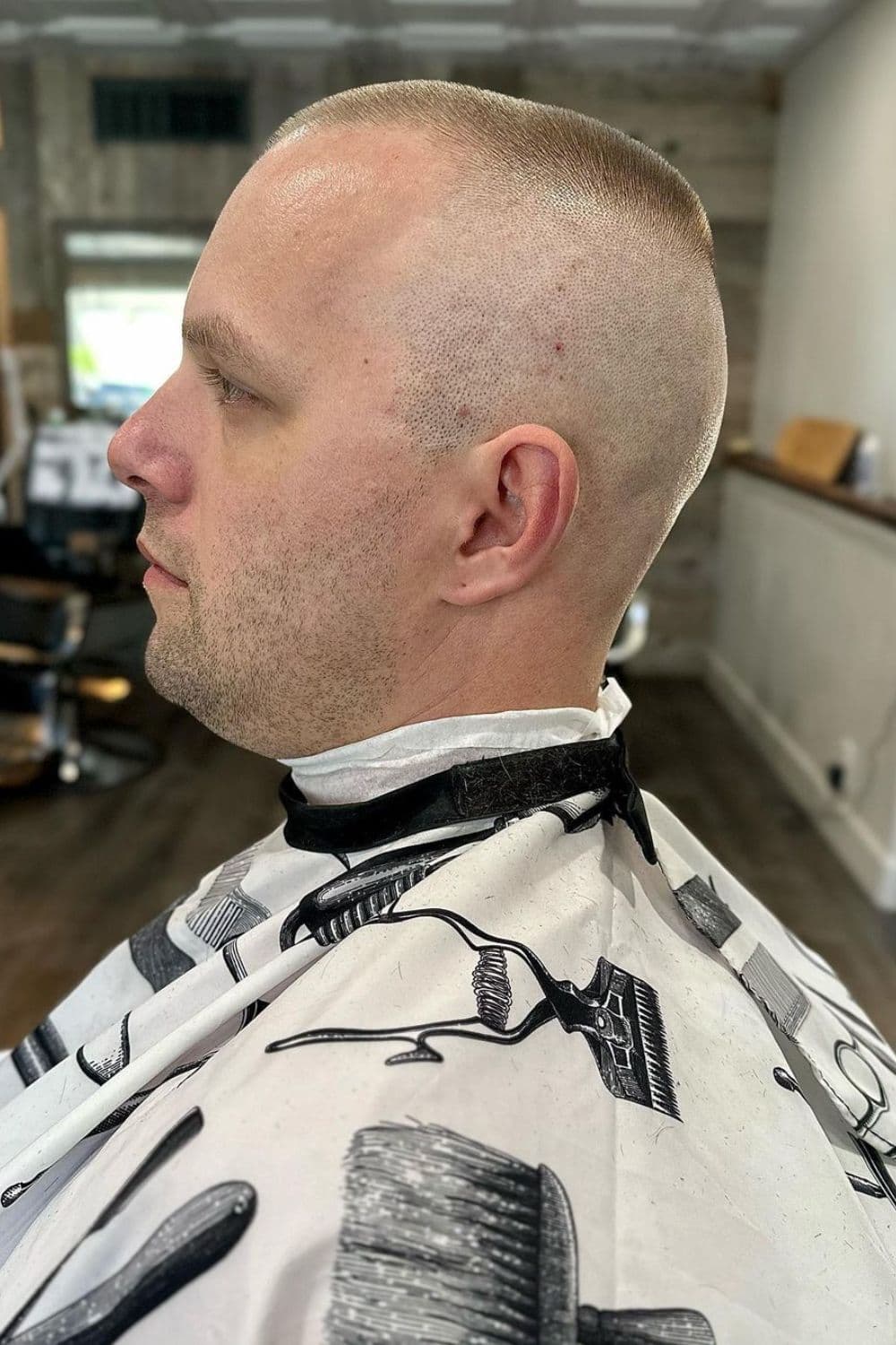 A man with a high and tight bald fade cut.