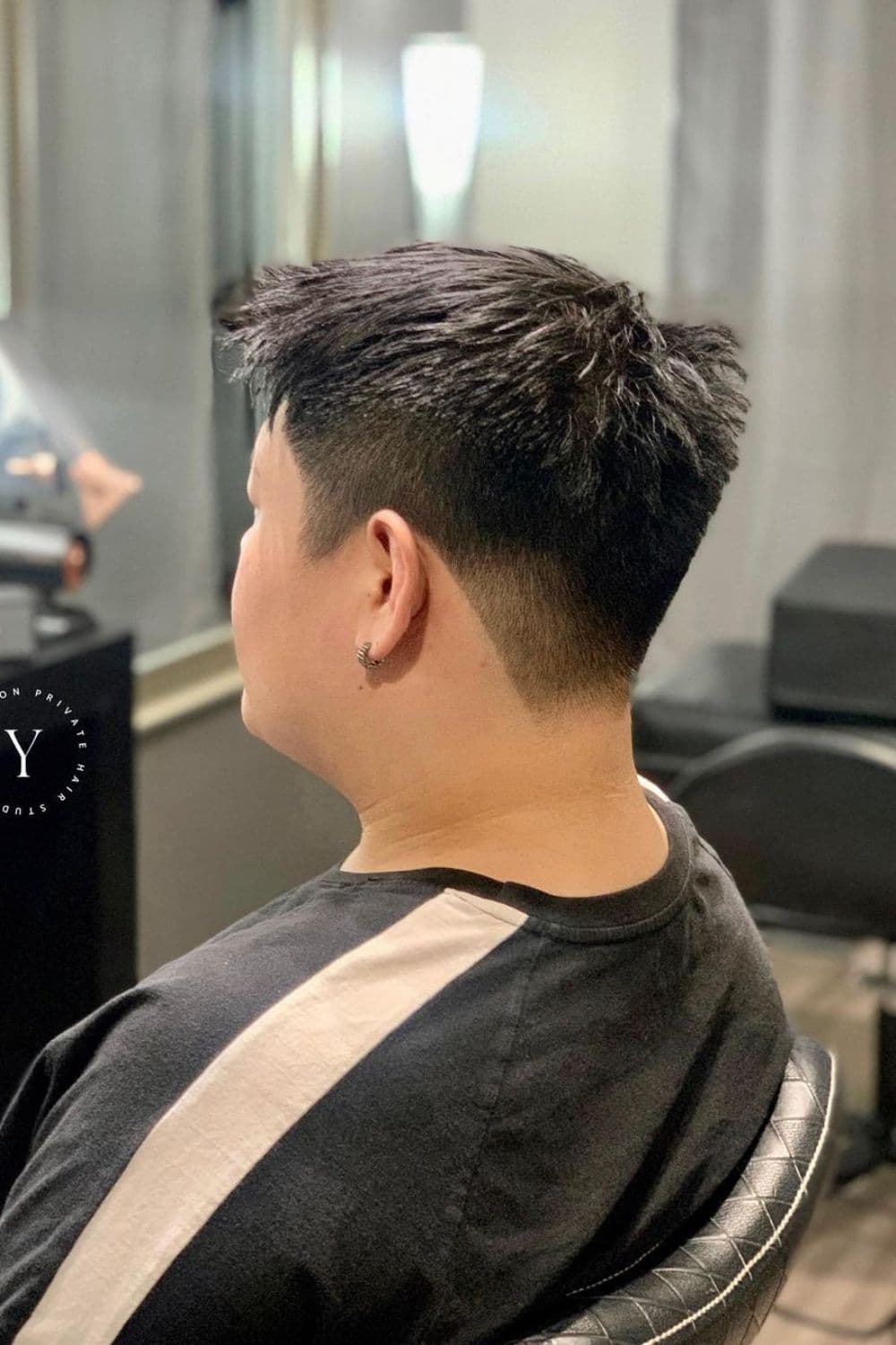 A man with ivy league low taper fade.