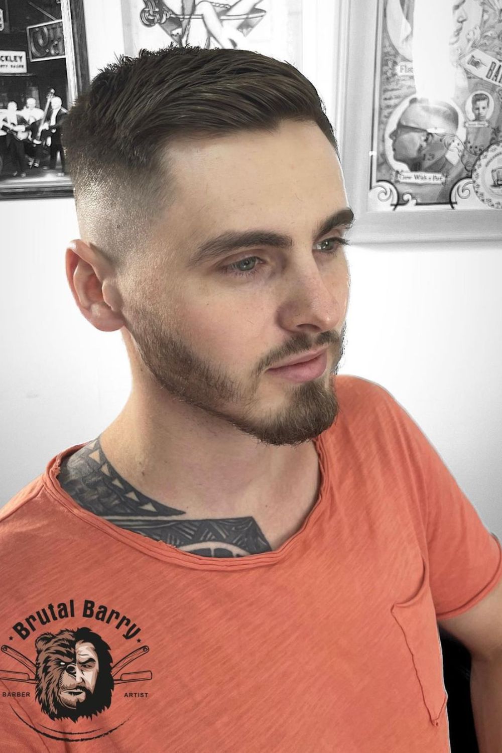 A man with a low fade quiff cut.
