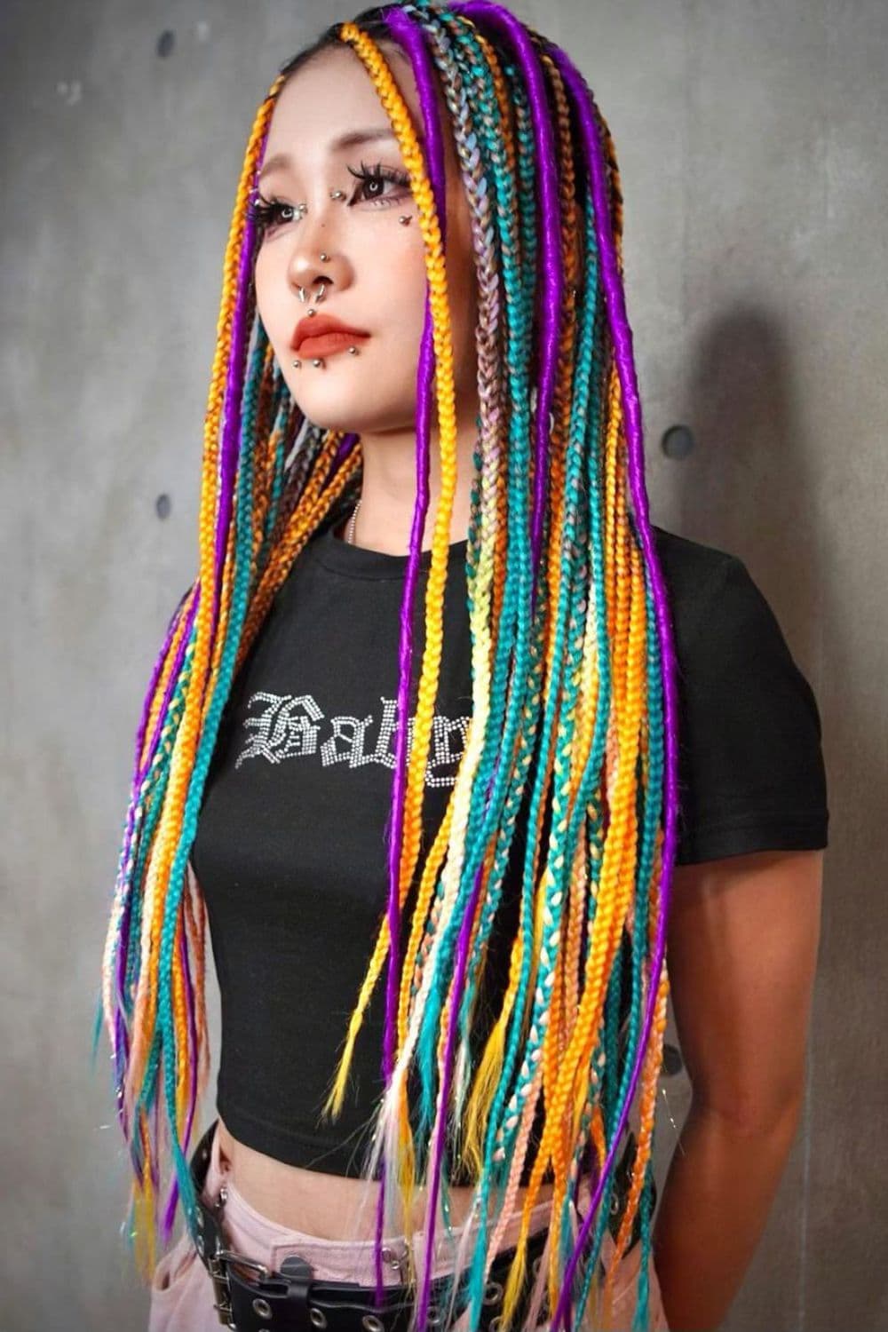 A woman with long multicolored braids.