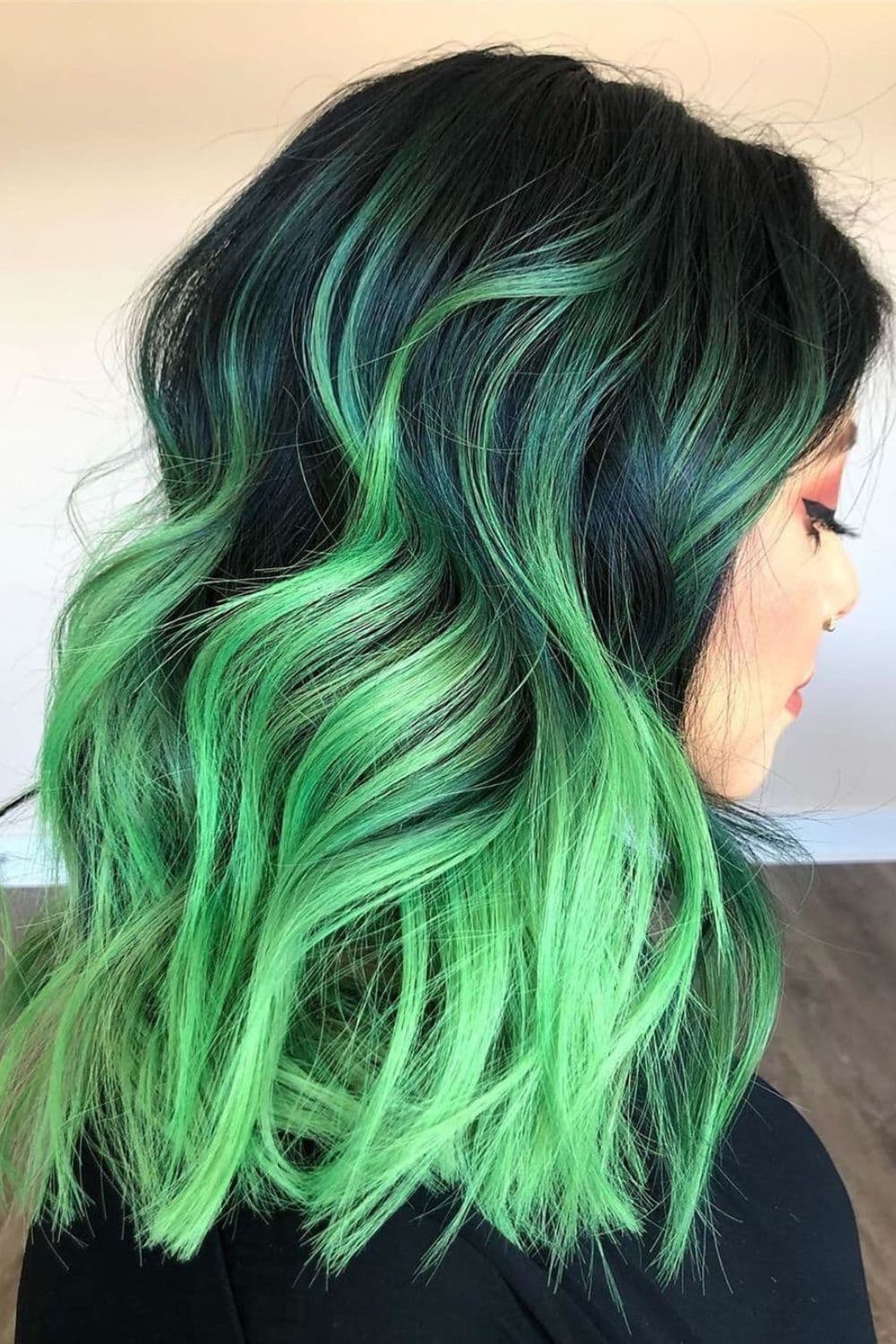 A woman with a neon green ombre hair.