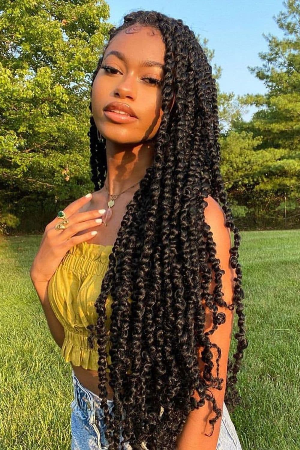 A woman with long black passion twists.