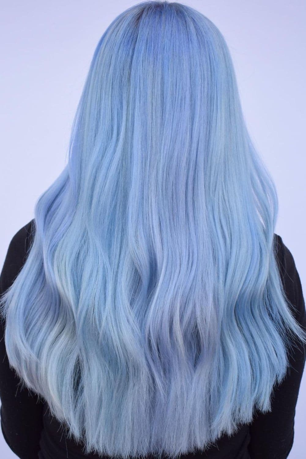 A woman with long pastel blue hair.