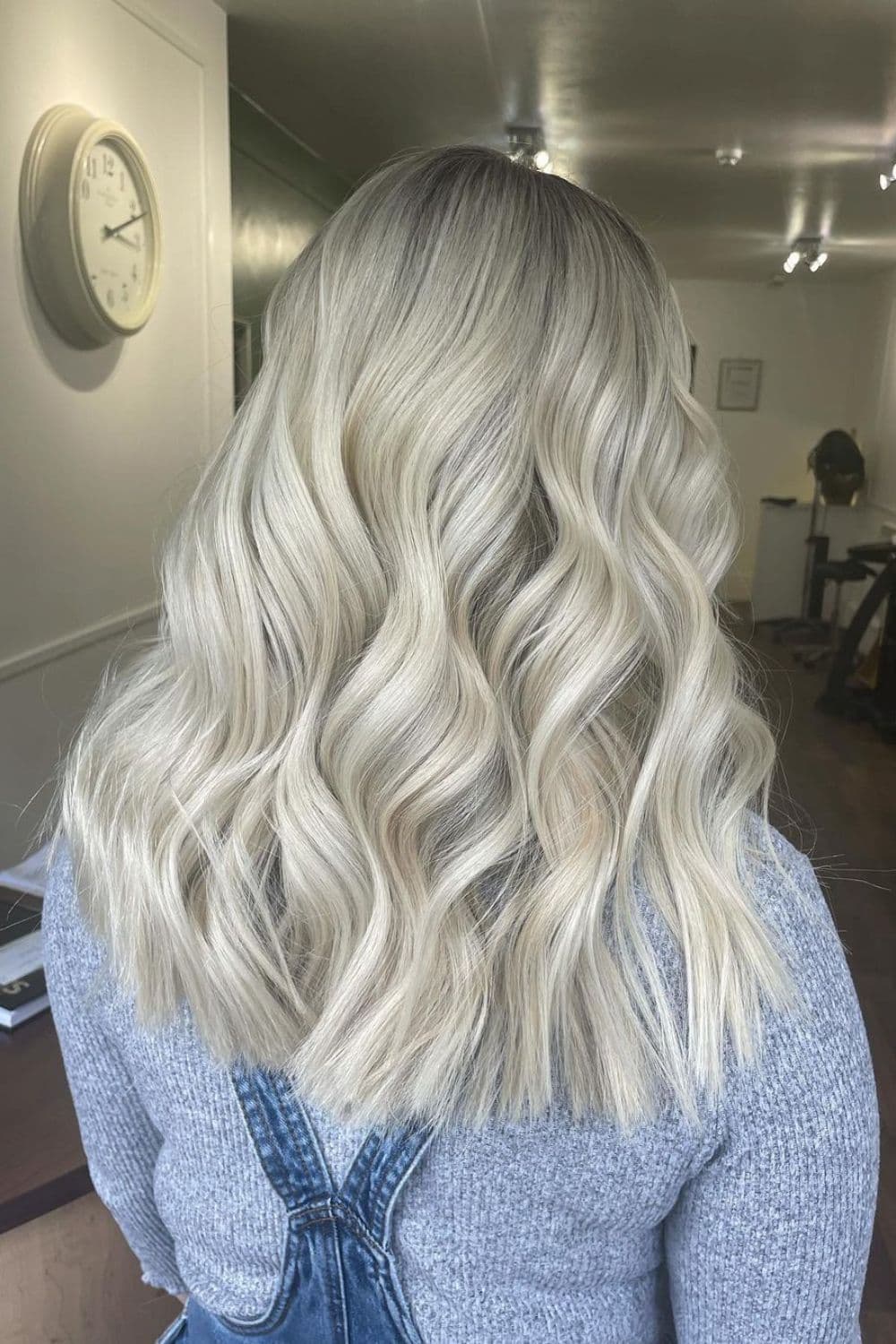A woman with a long, wavy pearl blonde.